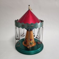 Giocattolo in latta giostra bambini seggiolini volanti 22x34 cm