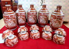 Set 5 bottiglie e 10 tazze da