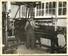 Press Photo A worker operates