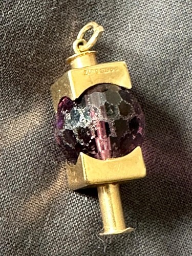 Pendente design oro e - in,