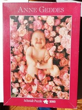 Schmidt Puzzle 1000 pezzi di Anne Geddes - Bambina tra le rose