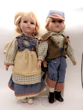 COPPIA BAMBOLE VINTAGE CON VISO E MANI IN CERAMICA -