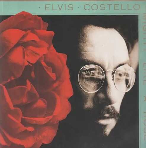 Elvis costello mighty like - costello,