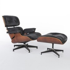 Poltrona e pouf Herman Miller Eames in nero e ciliegio originali