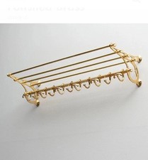 Scaffale in ottone lucido