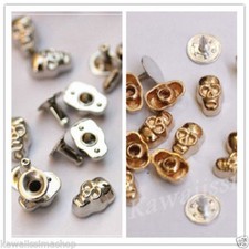Borchie sfuse in metallo a teschio con rivetto argento/oro 10x6mm a scelta
