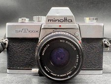 Minolta SRT 100x con obiettivo