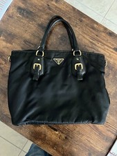 Borsa Prada in tessuto e pelle nera con triangolo smaltato