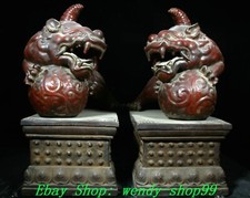 Coppia statuine sfera bestia