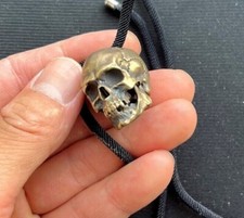 Statua testa di teschio ottone