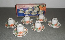 SERVIZIO DA CAFFE' DI SEI TAZZINE CON PIATTINO "REALITY" +  BRICCO PER IL LATTE