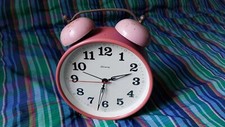 Antique wind up alarm clock
