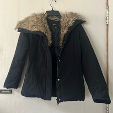 Piumino donna Sisley nero imbottito con colletto in pelliccia sintetica taglia XS usato