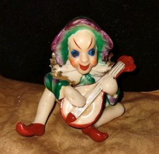 Elfo Pixie seduto porcellana