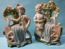 Coppia di antiche statuine in ceramica bianca,  GERMANY  13236  dim. 14x10x4 cm