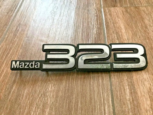 Mazda 323 logo sigla - sigla, emblema