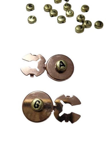 Pezzo copribottoni col oro - pezzo,