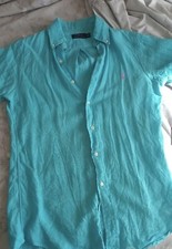 Camicia a maniche corte Ralph Lauren. Color azzurro con logo rosa. Tg XS/S