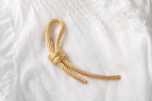 Spilla nodo corda metallo oro