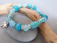 ?BRACCIALE DONNA PIETRE NATURALI DURE AZZURRE. BRILLANTINI E CHARMS.  N.17. ?