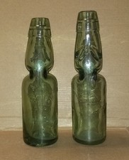 2 Bottiglie vetro con la