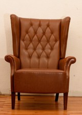 Poltrona a orecchioni stile