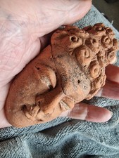 Greek terracotta mask of a