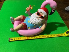 Statua Babbo Natale su fenicottero rosa