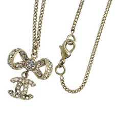 Collana CHANEL CC fiocco strass placcato oro