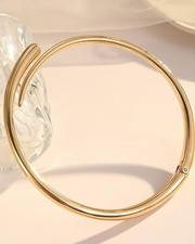 Collana rigida dorata in lega
