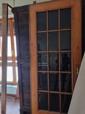 porta scorrevole in legno e vetro (83x2.10 più 7 cm. per ruote)  come nuova