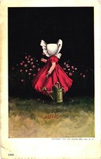 Una bambina in abito rosso che