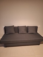 Divano/letto Ikea grigio usato poche volte, con vano contenitore.