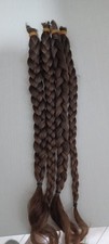Trecce di capelli veri lunghi 45-50cm, colore castano, lisci.