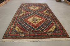 Antico tappeto annodato a mano