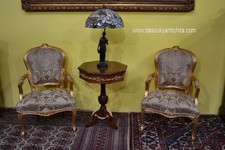 Coppia di poltrone dorate in