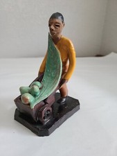 Statuina vintage uomo carrello