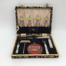 Vintage cocktail bar set in black and gold velvet box including bottle stoppers