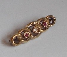 Spilla oro con rubini e