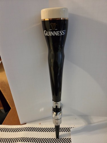 Guinness beer tap handle with - handle,