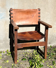 Antico seggiolone sedia poltrona da camino in legno e cuoio