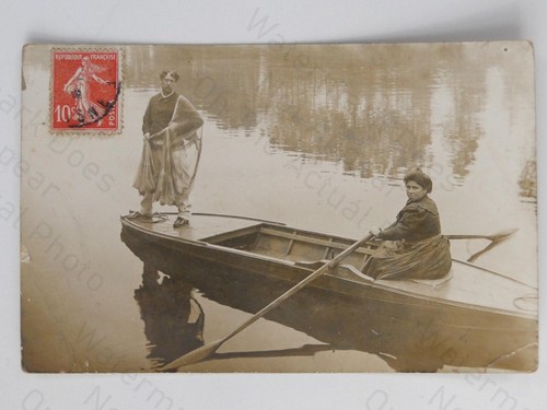 Man woman rowing boat - man,