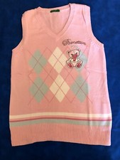 1 pantaloncini corti 1 canotta e un gilet rosa 6/7 anni femmina