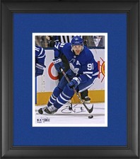 John Tavares Maple Leafs FRMD Signed 8x10 Blue Jersey Skating with Puck Photo