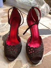 Decolletèe Cafènoir fantasia nera e interno rosso tacco spillo 10cm. 1 uscita