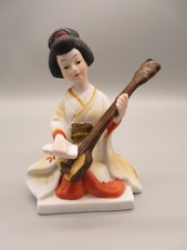 Geisha orientale in porcellana