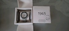 swatch omega 1965