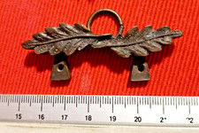Antico gancio in bronzo con