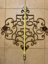 Appendiabiti a scomparsa vintage in ferro battuto dorato.