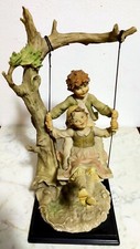 BRUNO MERLI "RAGAZZI IN ALTALENA"  CERAMICA PORCELLANA CAPODIMONTE  ORIGINALE